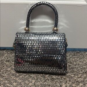 Chic Silver and Black Handbag with Gold Details